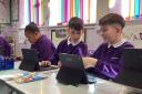 School pupils enjoying the new tablets