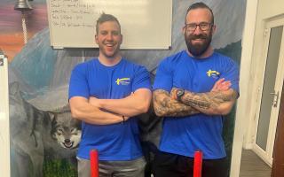 Steve Larsen (left) of WOLF gym is raising money for Tom's Trust