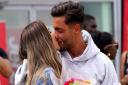 Ekin-Su Culculoglu and Davide Sanclimenti, Love Island 2022 winners, share a kiss at Stansted Airport in Essex after returning to the UK