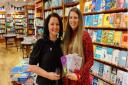 Author TA Rosewood (left) at the Hart's Books event in Saffron Walden with Sophie, holding the author's books