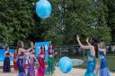 Mermaids from Pure Rhythm School of Performing Arts at the man-made beach which has opened on The Common, Saffron Walden