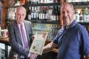 Graham Pearson, landlord of The Railway Arms Pub in Saffron Walden receives the award for CAMRA best pub of the year in North West Essex from Ian Fitzhenry, Chair of the local CAMRA group