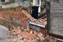 A damaged brick wall on Little Walden Road, Saffron Walden caused by Storm Eunice