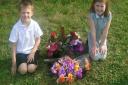 Christopher Bysouth, 6, and Natasha Bysouth, 7, pictured with the memorial before it was stolen.