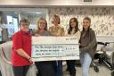 Beverley Leverton, Rosina, Abby and Natalie presented a cheque to The Grange Care Home
