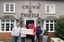 Mark and Ella from The Crown and Thistle pub presented a cheque to The Laughter Specialists