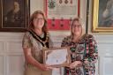 Claire Haddock was given a certificate for her 20 years of service