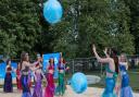 Mermaids from Pure Rhythm School of Performing Arts at the man-made beach which has opened on The Common, Saffron Walden