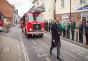 Fire and ambulance service personnel, and the public, line the route to pay respects to the late David Curtis in Saffron Walden