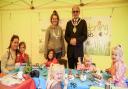 Saffron Walden Mayor Cllr Richard Porch with Sarah Edgeworth of Gardening for Kids and a group of young crafters at the pop-up session on the Market Square, Saffron Walden