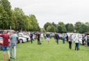 Visitors admire the vintage cars at the show