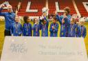 Saffron Walden PSG FC U9 girls show off the trophy won at The Valley, home of Charlton Athletic.
