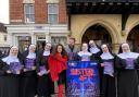 The cast of Sister Act in Saffron Walden, starring Gemma Alexander (in red) as Deloris