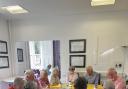 Service users and volunteers enjoying a catch up at Saffron Walden's Forget Me Not Dementia Café