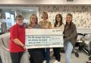 Beverley Leverton, Rosina, Abby and Natalie presented a cheque to The Grange Care Home