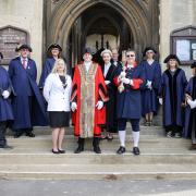 Saffron Walden's new Mayor and Mayoress, Cllr James de Vries and Mrs Sheila de Vries, Mace Bearer Mark Starte, the Deputy Town Clerk, the Reverend Jeremy Trew and Councillors on the steps of St Mary's Church, Saffron Walden