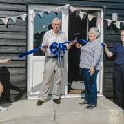 The ribbon is cut on the new Danaher Meet and Greet and Education Centre at Wethersfield by chair of trustees Richard Lord (centre) and long-term volunteer Maz Edwards. Pictured with them are Maisie Garvey and Sam Garvey.