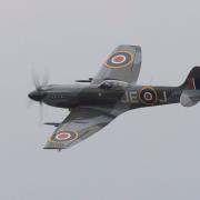 Supermarine Spitfire Mk XIV displaying at IWM Duxford at the Flying Days: The Fighters event.