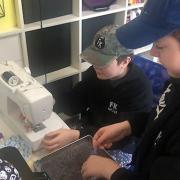 Twins Ollie and Leo KIernan have been sewing lavender bags to cheer up people in care homes.