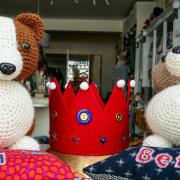 Corgis made of British wool in the Craft Days shop window, Saffron Walden to help to celebrate the Platinum Jubilee
