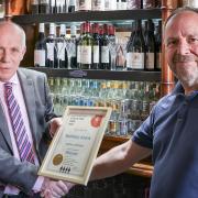Graham Pearson, landlord of The Railway Arms Pub in Saffron Walden receives the award for CAMRA best pub of the year in North West Essex from Ian Fitzhenry, Chair of the local CAMRA group