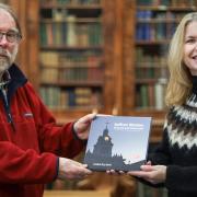 Martyn Everett, Gibson Library chair, receives a copy of Celia Bartlett's new book called Saffron Walden Locked and Unlocked
