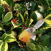 A Christmas decoration with a robin made by the Saffron Walden and District Flower Club