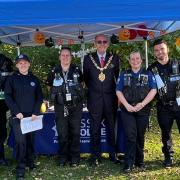 Saffron Walden mayor Richard Porch with members of the Community Policing Team in Bridge End Gardens