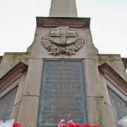 Poppy wreaths on the war memorial, Saffron Walden. Picture: Celia Bartlett Photography