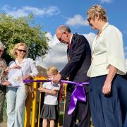 Daisy, who won an art competition, and the Mayor of Saffron Walden cut a ribbon to open the Golden Acre playground. Picture: Will Durrant