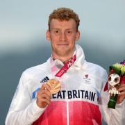 Great Britain's George Peasgood celebrates with the bronze medal in the Men's C4 Time Trial on day seven of the Tokyo 2020 Paralympic Games