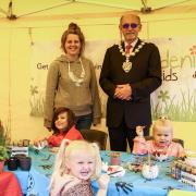 Saffron Walden Mayor Cllr Richard Porch with Sarah Edgeworth of Gardening for Kids and a group of young crafters at the pop-up session on the Market Square, Saffron Walden