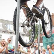 Rich Pearson performs a BMX height jump stunt in Saffron Walden