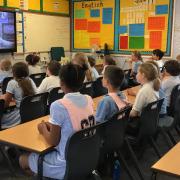 Class 5 at Linton Heights warm up for a record-breaking singalong accompanied by Billy Ocean. Picture: Linton Heights Junior School