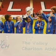 Saffron Walden PSG FC U9 girls show off the trophy won at The Valley, home of Charlton Athletic.