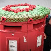 Anna with her crocheted pillar box top in Saffron Walden