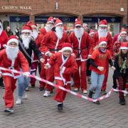 Crowds took part in the Santa Dash in Saffron Walden on Sunday. Pics: Celia Bartlett
