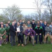 Walden receive the league shield and the Cambridgeshire Cup from Ian Forton, division secretary of London RFU. Picture:  GRAHAM MARSHALL