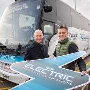John Boughton, commercial director for National Express UK and Ireland, and Paul Garnett, car park and ancillaries director for London Stansted Airport with the electric coach