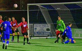 Saffron Walden Town goalkeeper James Young looks on at Barking